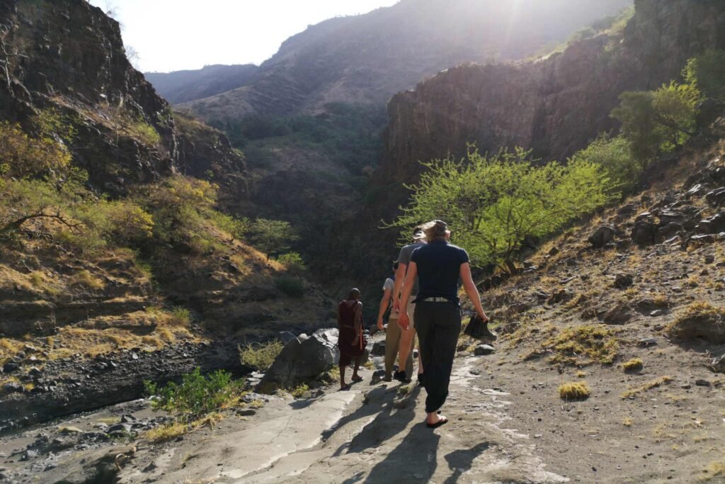 A group on a guided walking and trekking adventure in Ngare Sero Gorge at Lake Natron.