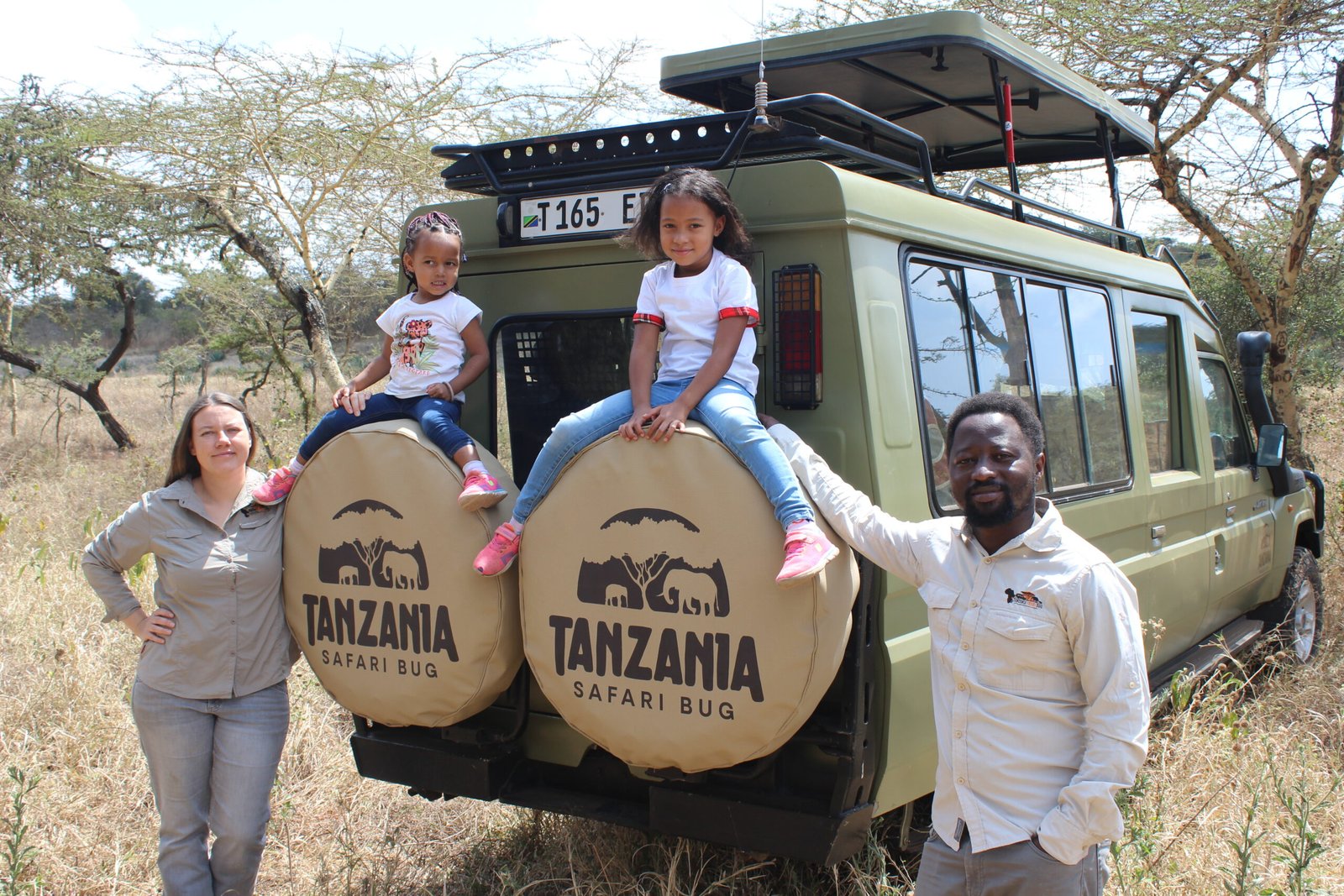 The Tanzania Safari Bug family on a safari car adventure.